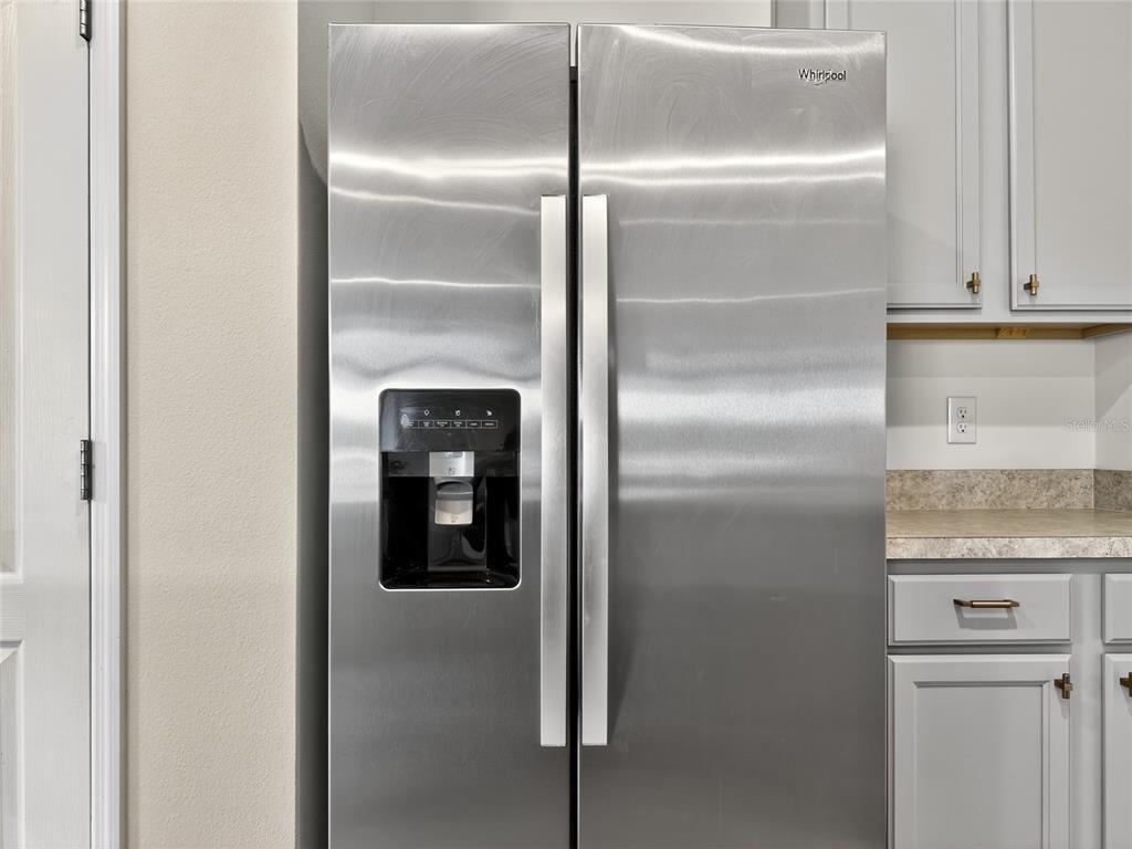 2597 Shamrock Street Tavares, FL 32778 - Photo 7 of 57 a close view of a refrigerator in kitchen counter top