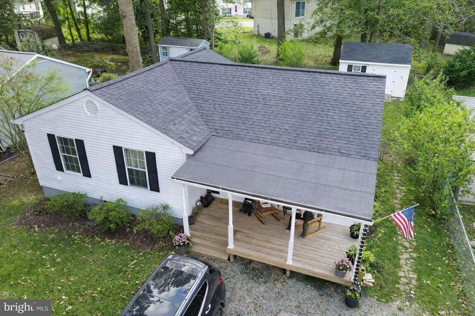 8315 Cedar Lane Lusby, MD 20657 - Photo 2 of 3 a view of a small house with a yard