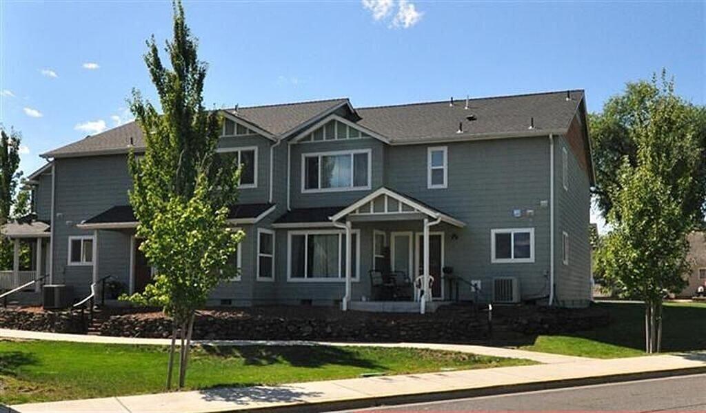 90 Suncrest Road Talent, OR 97540 - Photo 1 of 5 a front view of a house with garden