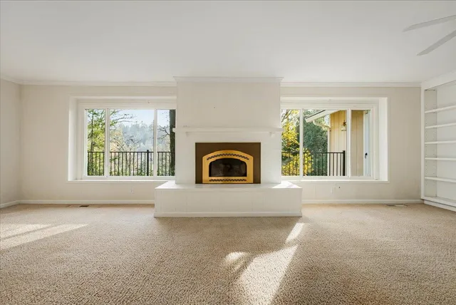 a kitchen with stainless steel appliances a stove a sink a microwave a refrigerator and cabinets