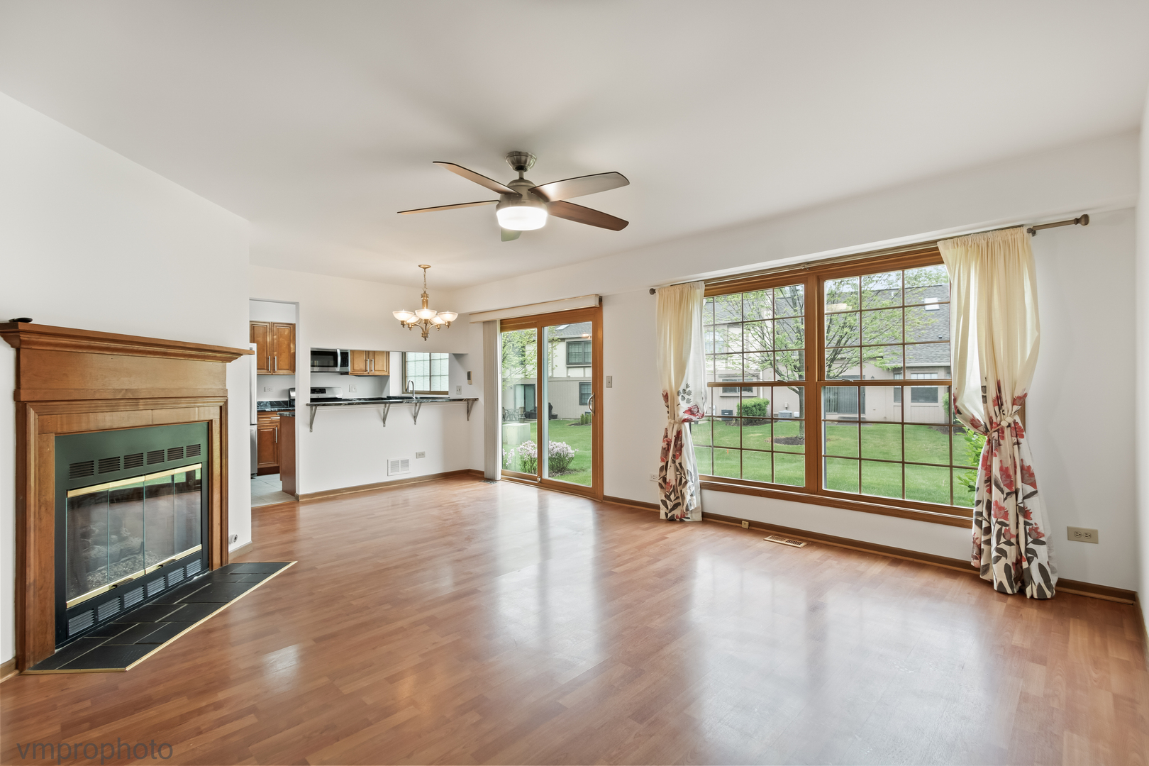 4549 Topaz Drive Hoffman Estates, IL 60192 - Photo 4 of 20 a view of an empty room with a fireplace and a window
