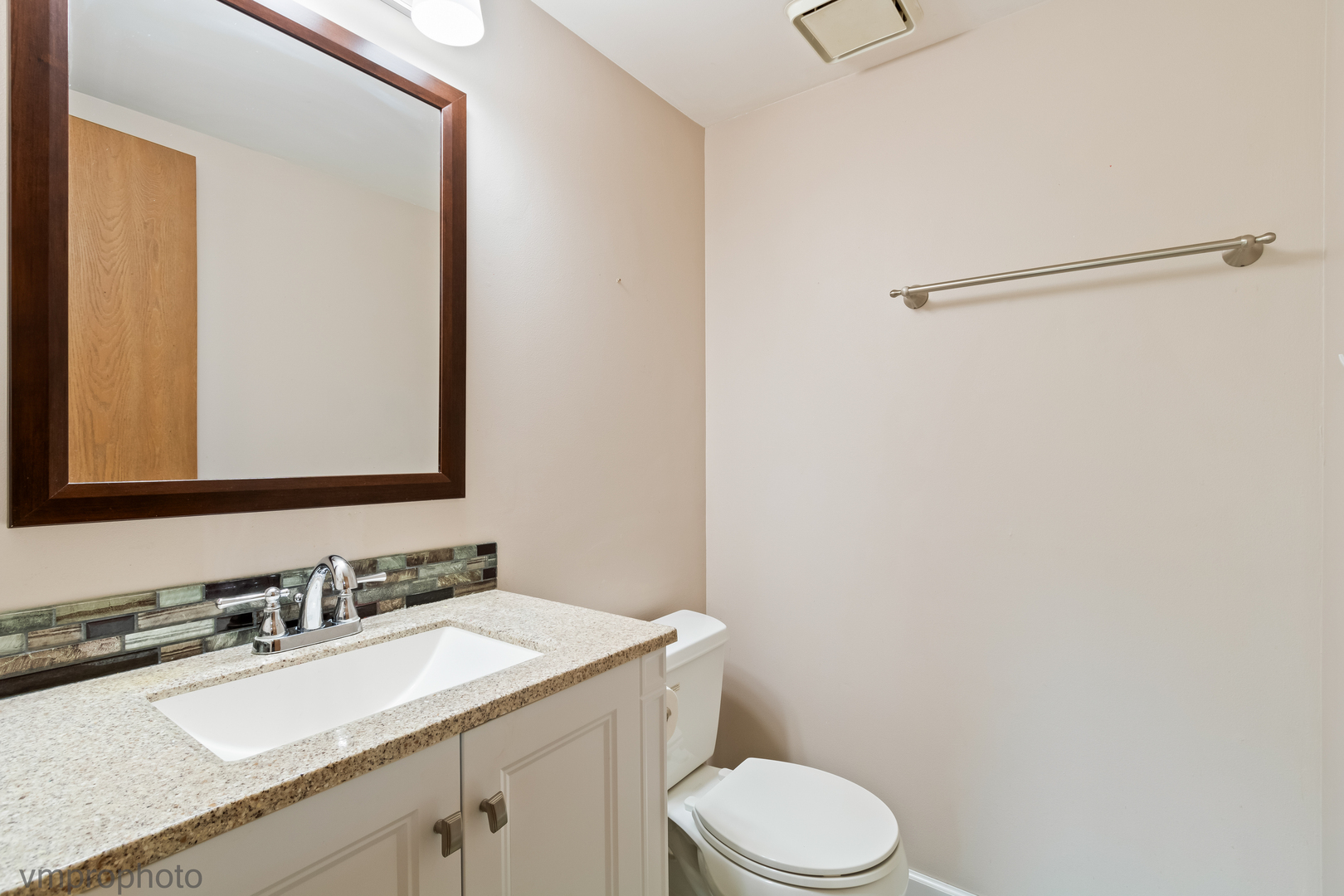 4549 Topaz Drive Hoffman Estates, IL 60192 - Photo 7 of 20 a bathroom with a granite countertop sink mirror vanity and toilet