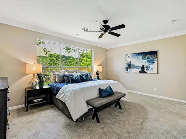 a bed room with a bed and a window