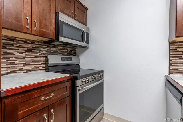 a kitchen with a stove and a microwave