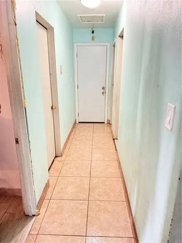 a kitchen with stainless steel appliances kitchen island granite countertop a refrigerator and a stove