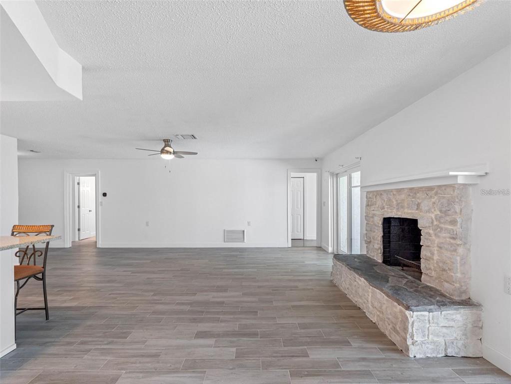 562 Johns Pass Avenue Madeira Beach, FL 33708 - Photo 18 of 51 a view of a livingroom with a fireplace and window