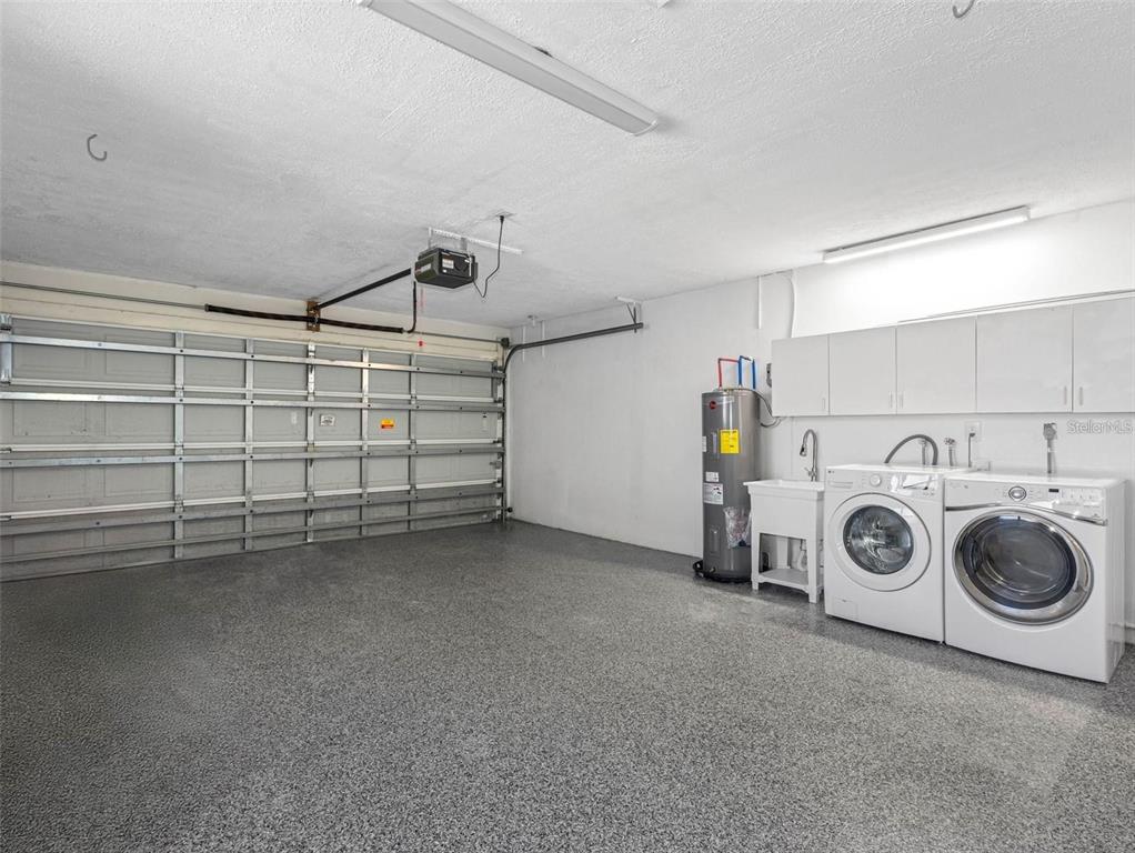 562 Johns Pass Avenue Madeira Beach, FL 33708 - Photo 35 of 51 a view of a storage & utility room with washer and dryer