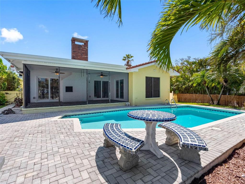 562 Johns Pass Avenue Madeira Beach, FL 33708 - Photo 40 of 51 a front view of a house with porch and furniture