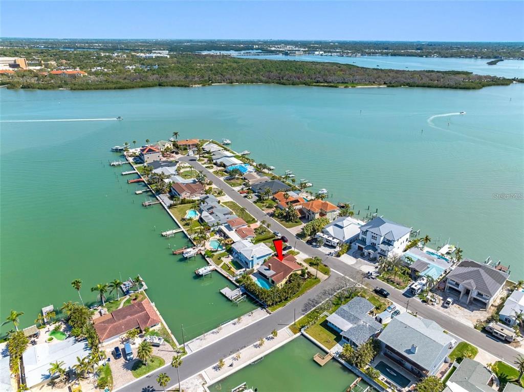 562 Johns Pass Avenue Madeira Beach, FL 33708 - Photo 4 of 51 an aerial view of a residential houses with lake view