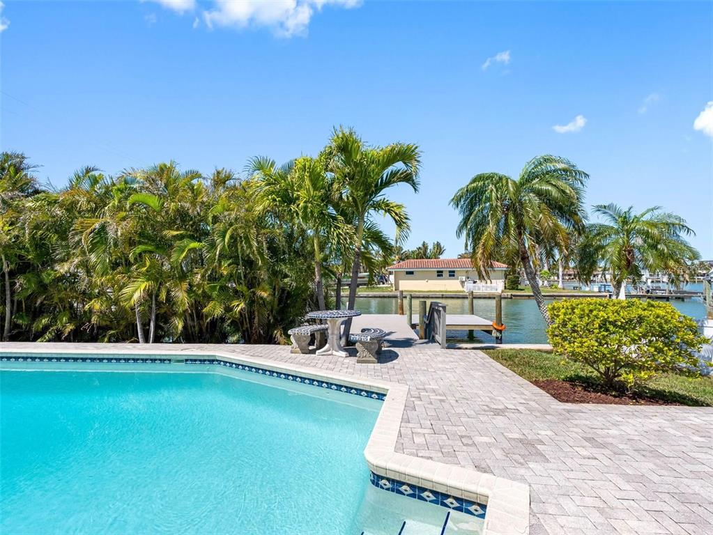 562 Johns Pass Avenue Madeira Beach, FL 33708 - Photo 8 of 51 a view of a house with swimming pool and sitting area