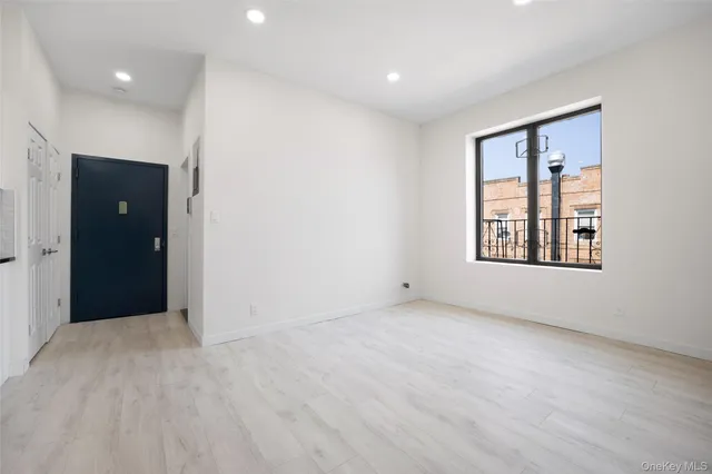 a view of an empty room with a window