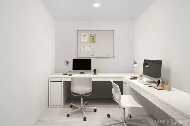 a view of a workspace with furniture