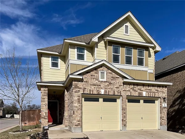 a front view of a house with a garage