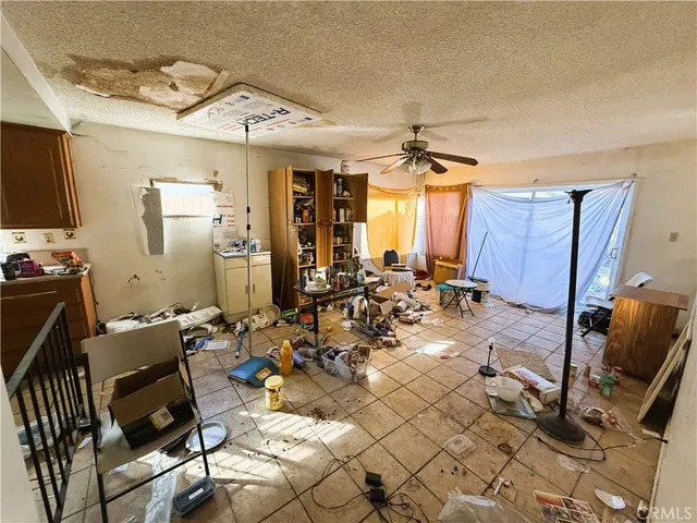 a picture of a living room with a couch and a window
