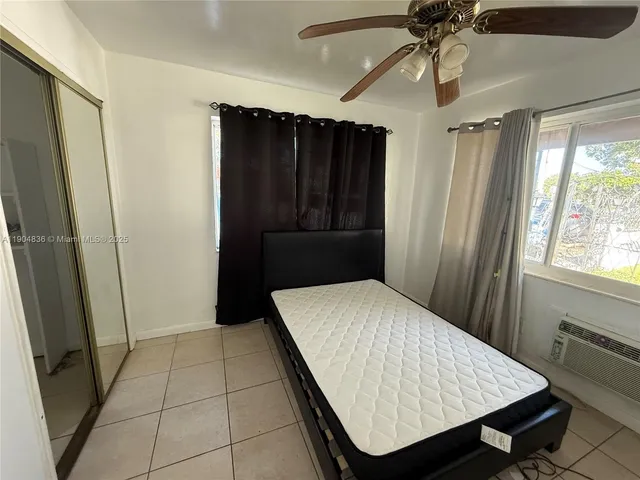 a room with closet and wooden floor