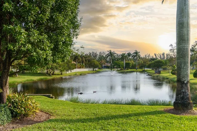 a view of a lake with houses in the background