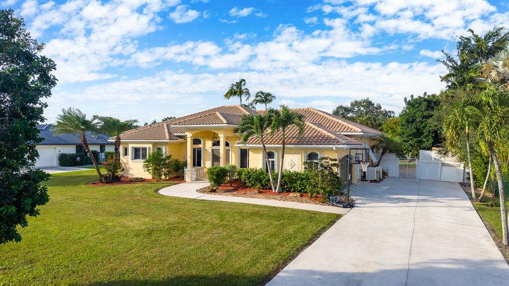 5973 Southwest 54th Court Davie, FL 33314 - Photo 2 of 49 a front view of a house with a yard