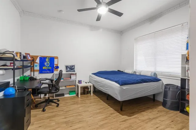 a bedroom with furniture and a book shelf