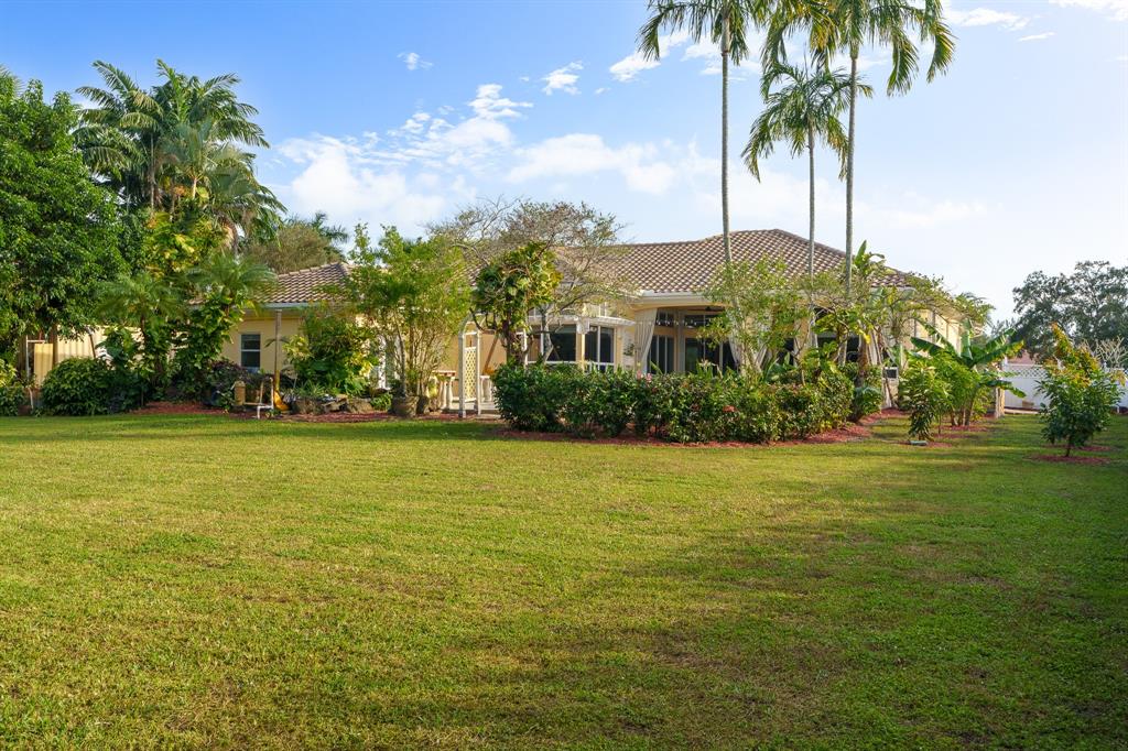 5973 Southwest 54th Court Davie, FL 33314 - Photo 38 of 49 a front view of house with yard and trees