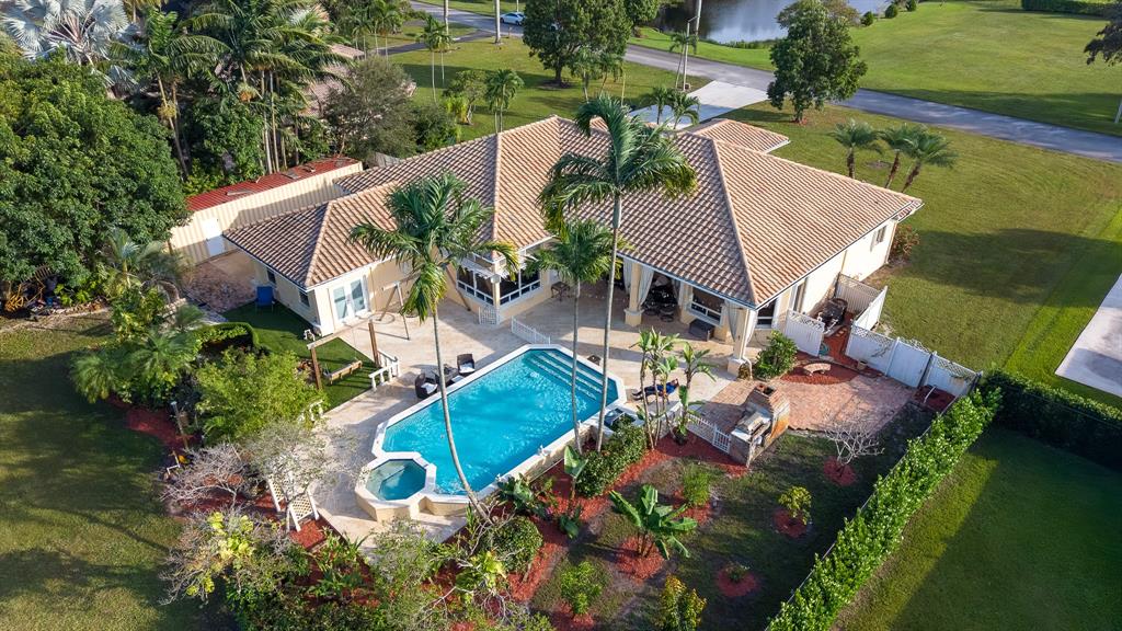5973 Southwest 54th Court Davie, FL 33314 - Photo 42 of 49 an aerial view of a house with outdoor space and lake view