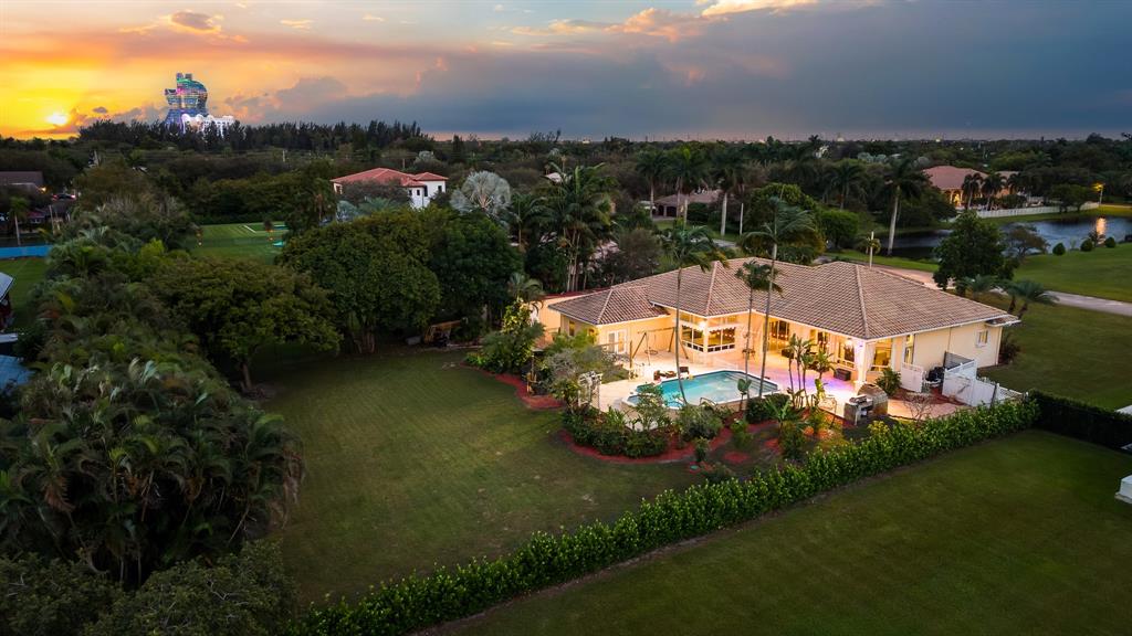 5973 Southwest 54th Court Davie, FL 33314 - Photo 47 of 49 an aerial view of a house with a garden and lake view
