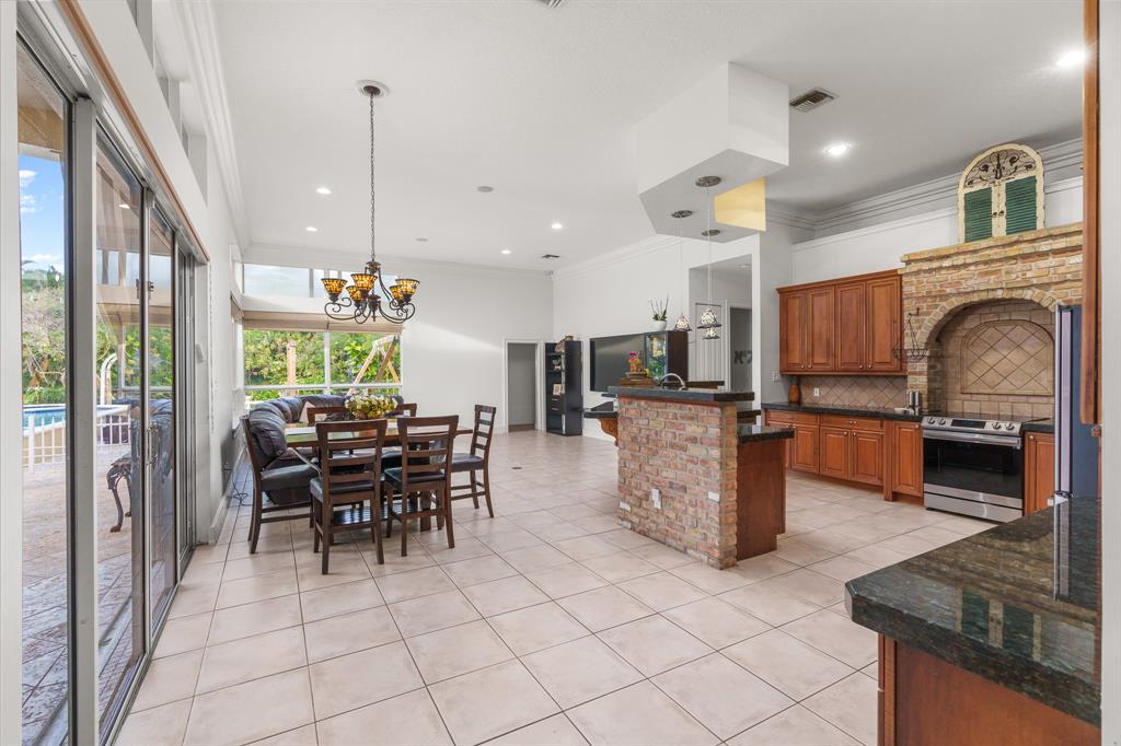5973 Southwest 54th Court Davie, FL 33314 - Photo 9 of 49 a view of a dining room with furniture window and outside view