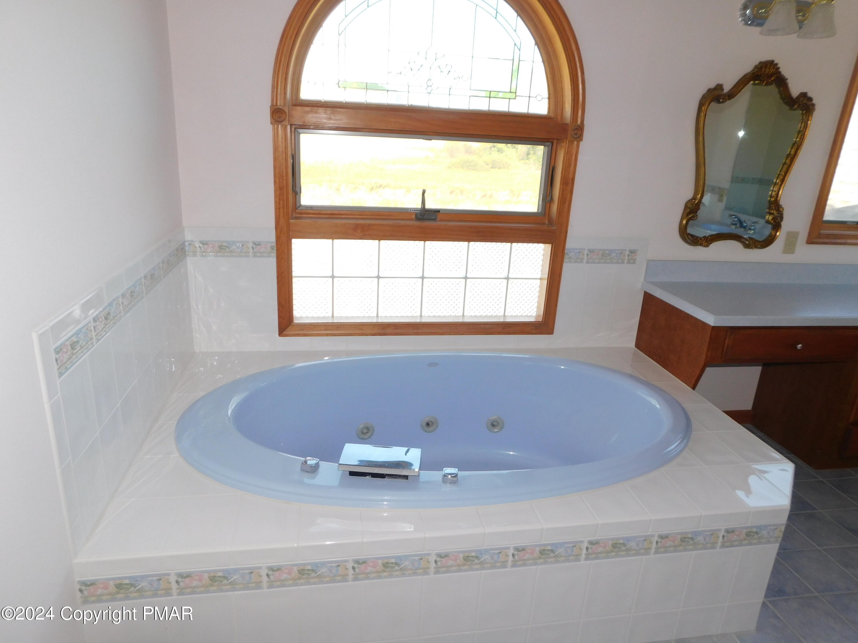1258 Beaver Valley Road Stroudsburg, PA 18360 - Photo 23 of 65 a bath tub sitting in a bathroom next to a window