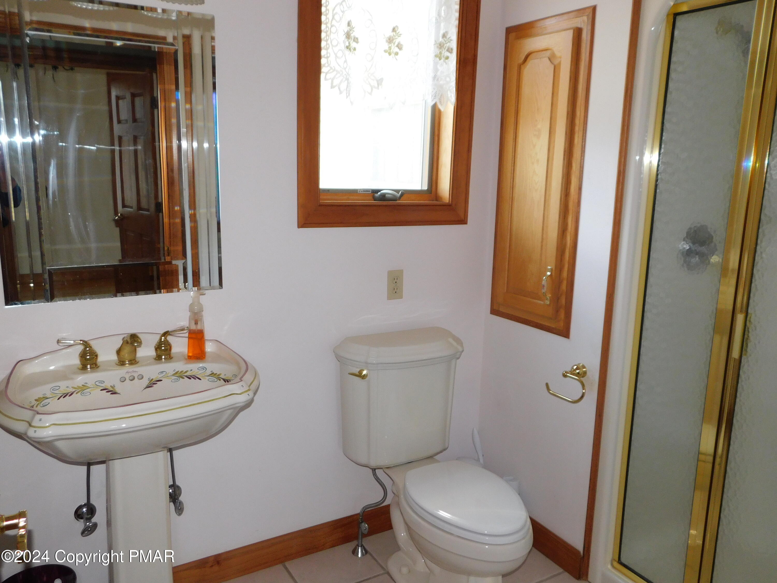 1258 Beaver Valley Road Stroudsburg, PA 18360 - Photo 34 of 65 a bathroom with a toilet a sink and a mirror