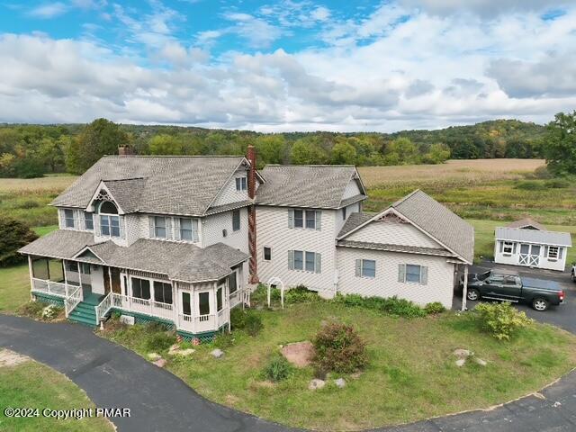 1258 Beaver Valley Road Stroudsburg, PA 18360 - Photo 55 of 65 an aerial view of a house with swimming pool and mountains in the background