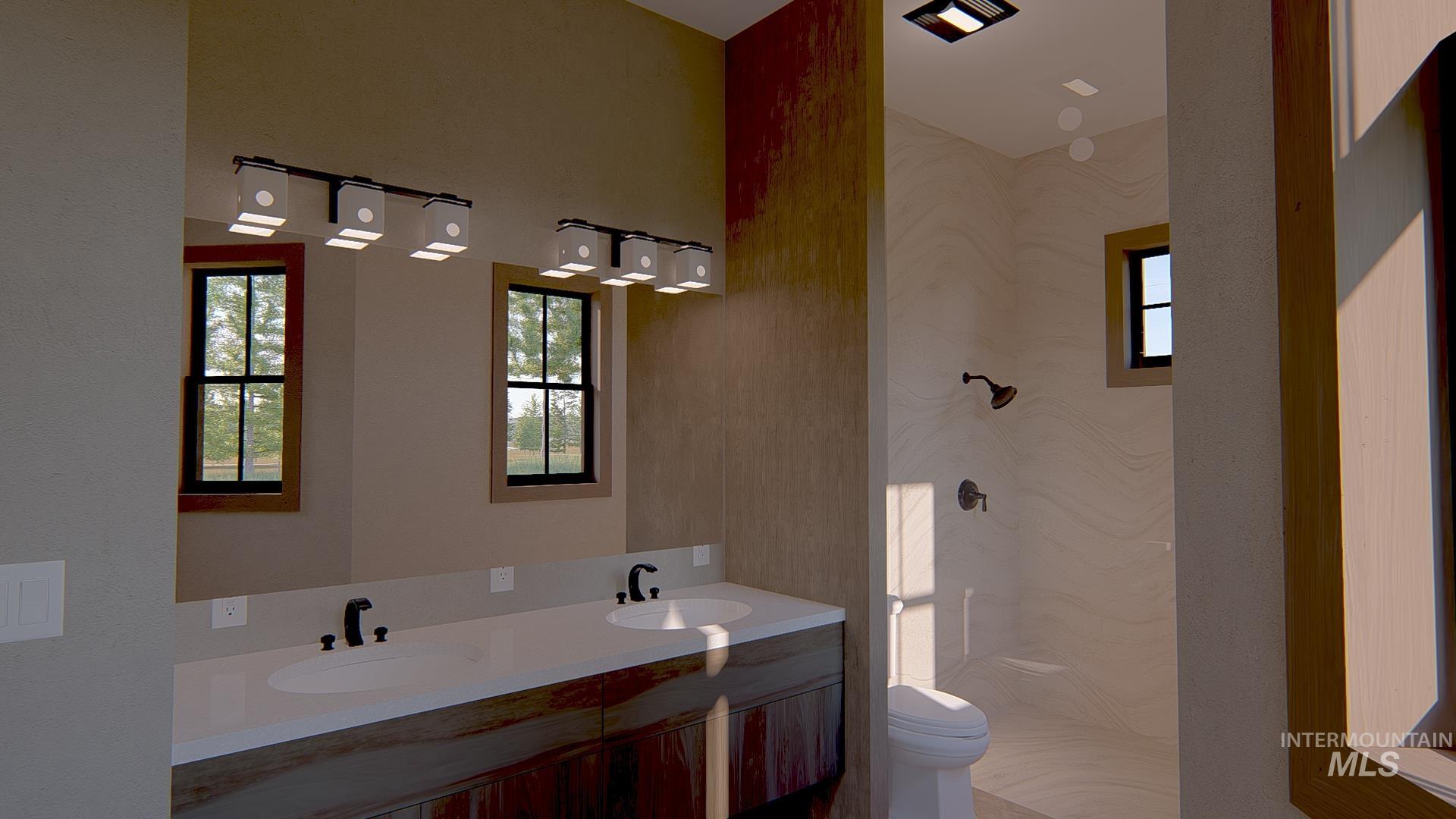 212 Rawhide Loop McCall, ID 83638 - Photo 11 of 28 Bathroom featuring double vanity and a marble finish shower