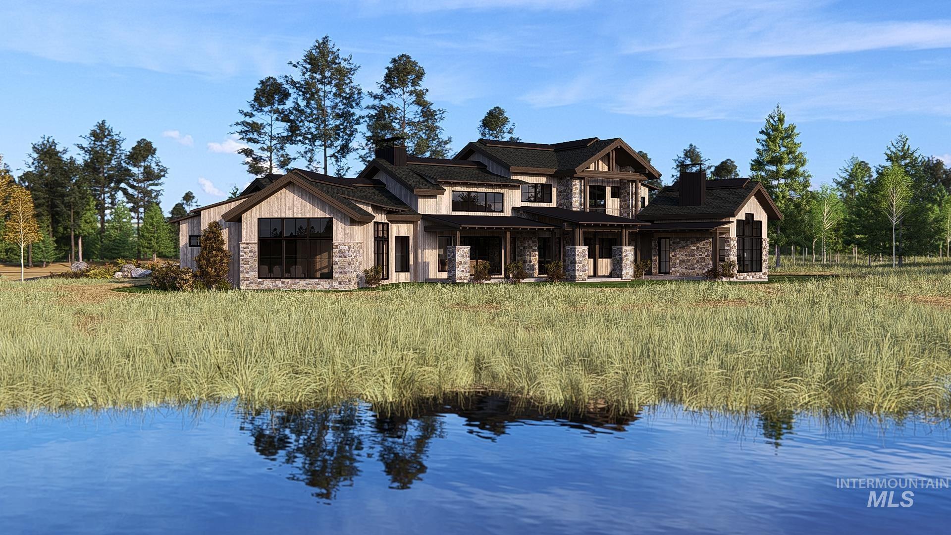 212 Rawhide Loop McCall, ID 83638 - Photo 2 of 28 Back of property featuring stone siding, a water view, a chimney, and a porch