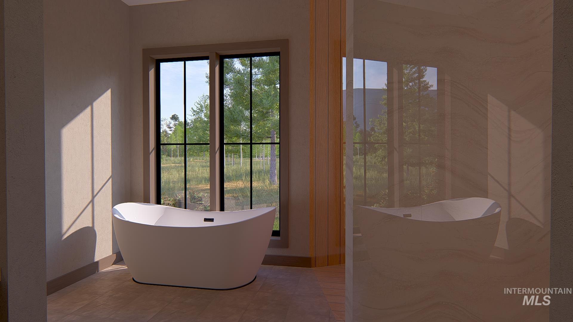 212 Rawhide Loop McCall, ID 83638 - Photo 22 of 28 Bathroom featuring a soaking tub and a marble finish shower