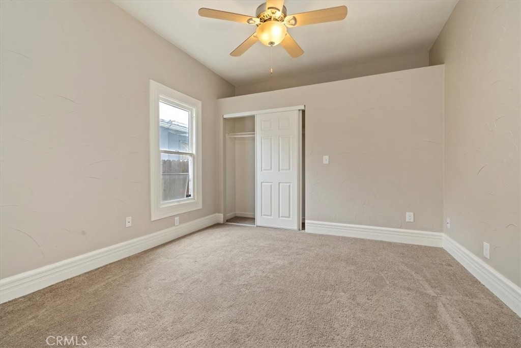 4336 6th Street Riverside, CA 92501 - Photo 13 of 19 an empty room with windows and fan