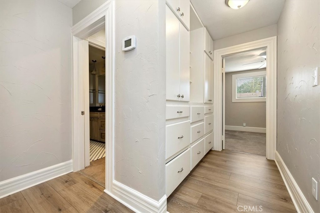 4336 6th Street Riverside, CA 92501 - Photo 15 of 19 a view of a hallway with closet and wooden floor