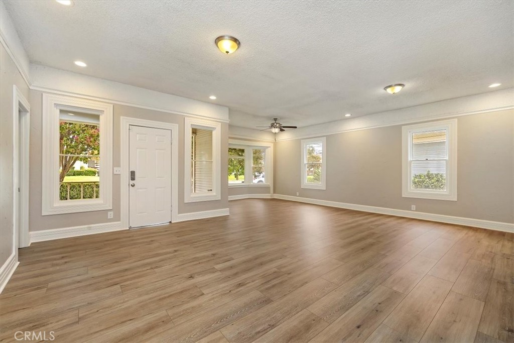 4336 6th Street Riverside, CA 92501 - Photo 4 of 19 an empty room with wooden floor and windows