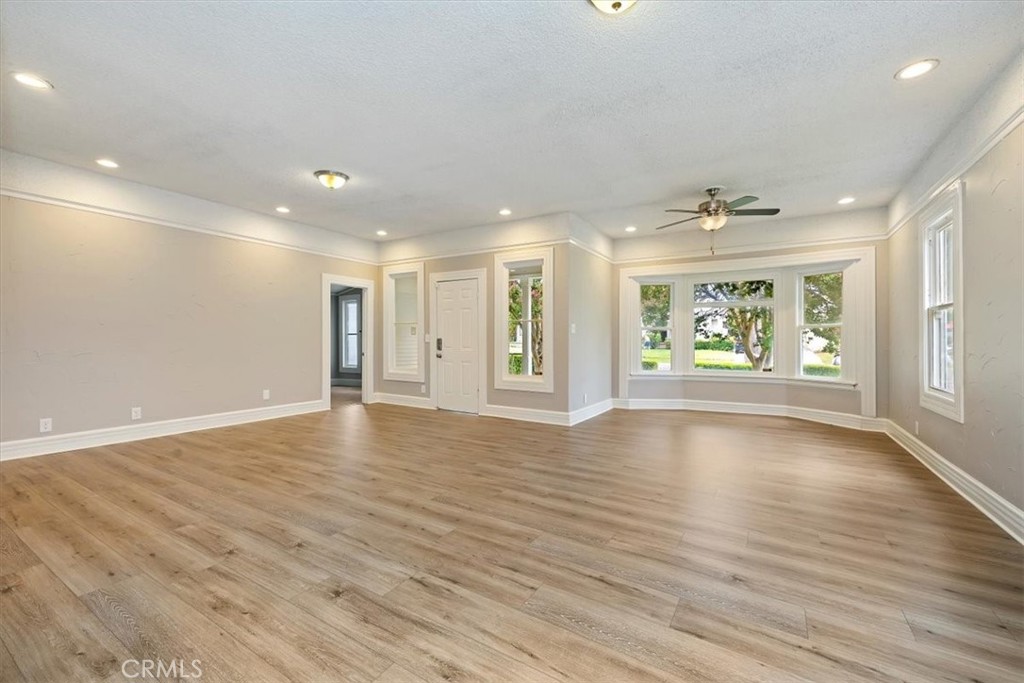 4336 6th Street Riverside, CA 92501 - Photo 5 of 19 a view of an empty room with a window and wooden floor