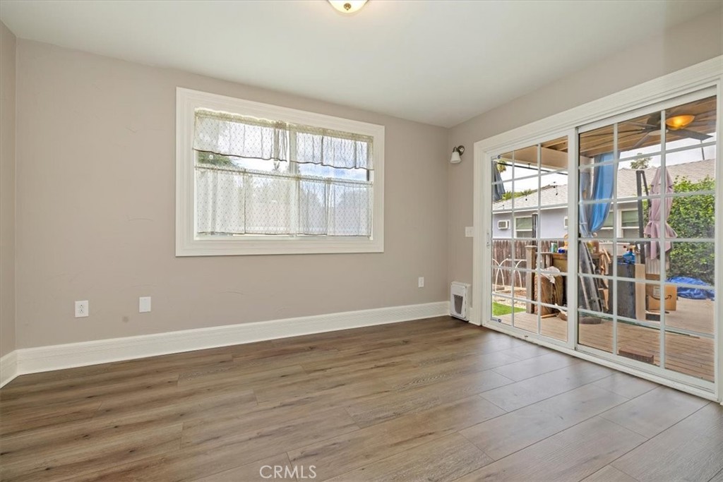 4336 6th Street Riverside, CA 92501 - Photo 10 of 19 an empty room with wooden floor and windows