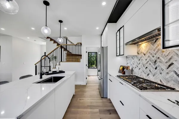 a kitchen with lots of appliances