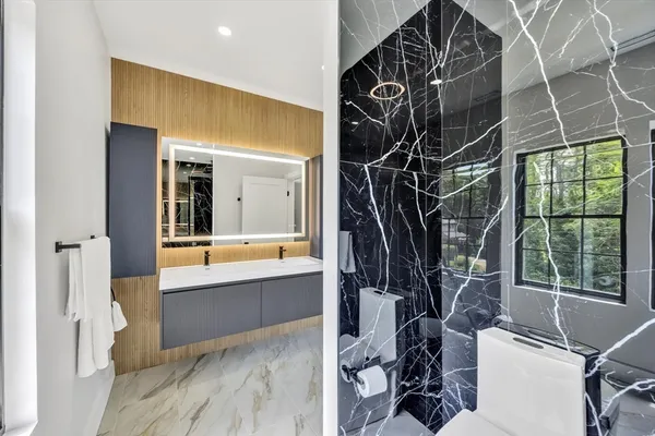 a bathroom with a bathtub and a window