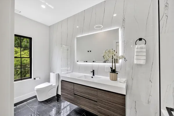 a bathroom with a sink double vanity and a mirror