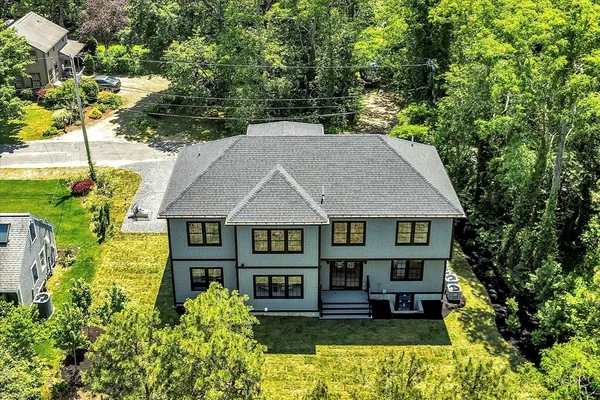 an aerial view of a house with swimming pool