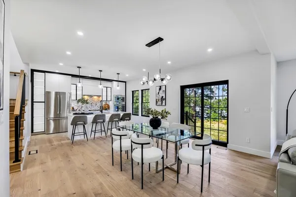 a view of a dining room with furniture window and wooden floor