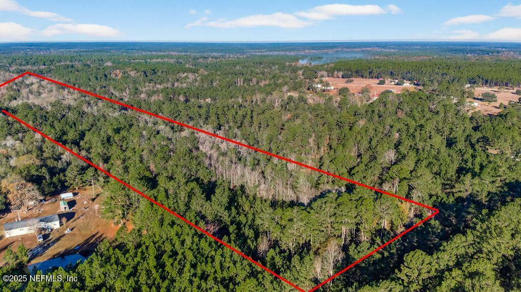 0 Do Hi Way Hilliard, FL 32046 - Photo 2 of 31 an aerial view of residential houses with outdoor space and seating