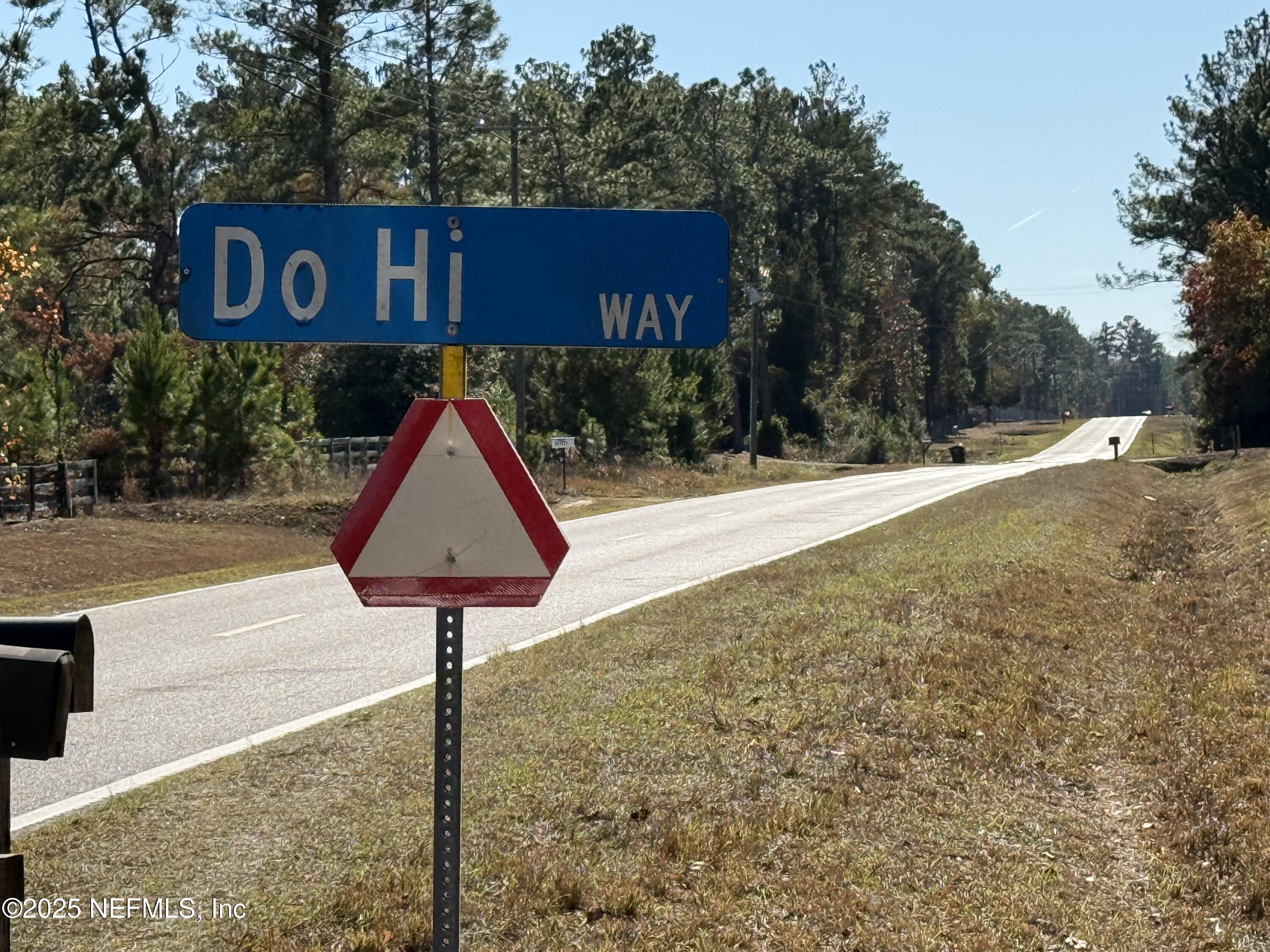 0 Do Hi Way Hilliard, FL 32046 - Photo 9 of 31 a street sign sitting on the side of a road