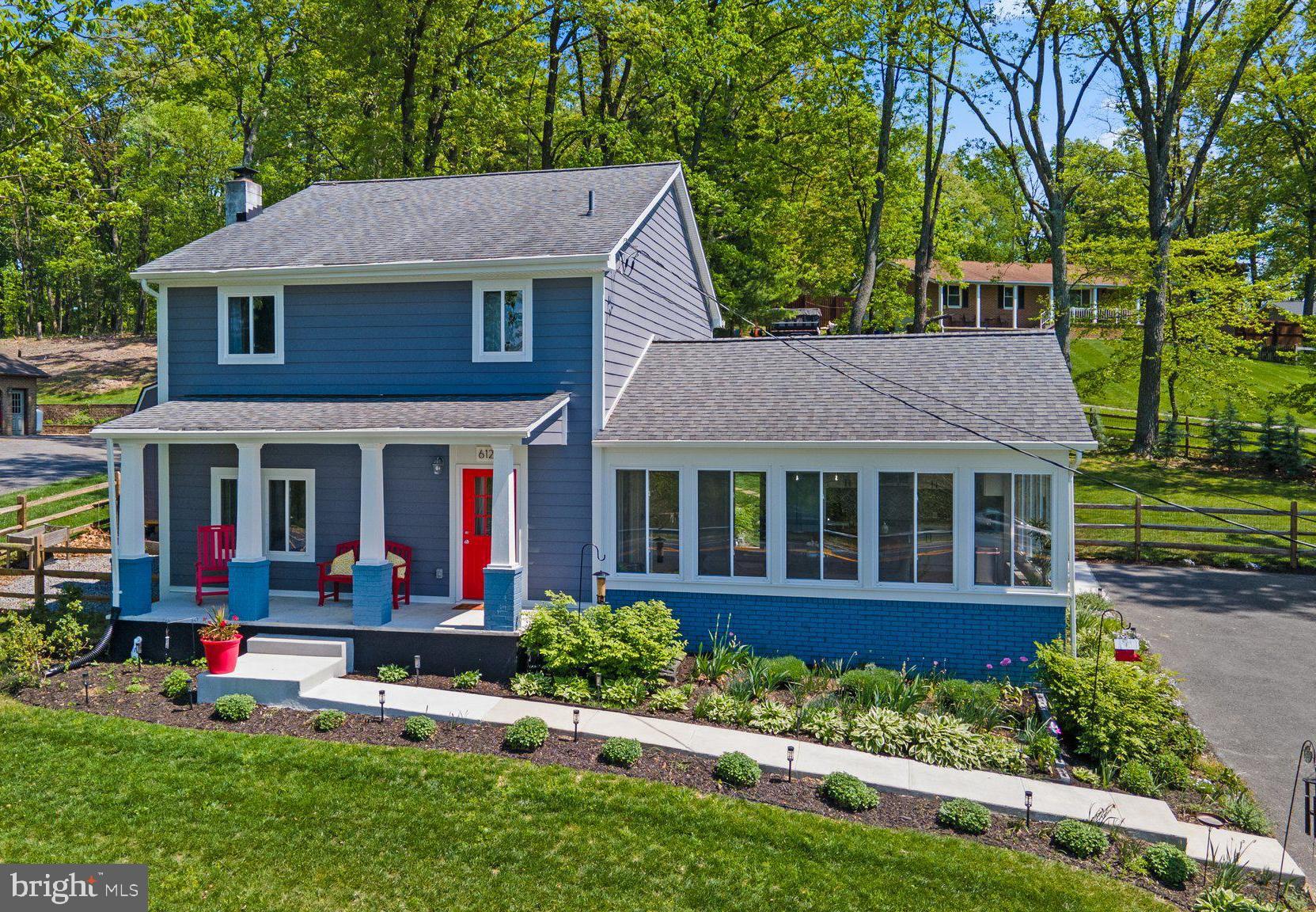 6121 Quinn Road Frederick, MD 21701 - Photo 3 of 47 the front and side flower beds are amazing!