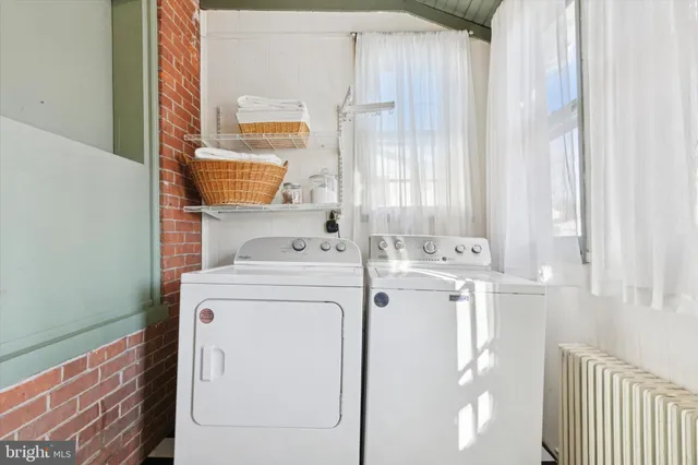 a utility room with dryer and washer