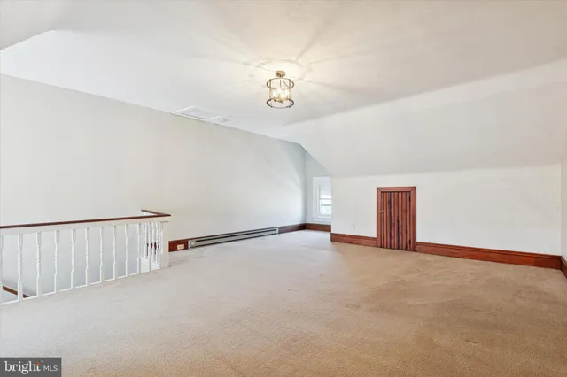 a view of a wooden house with a yard