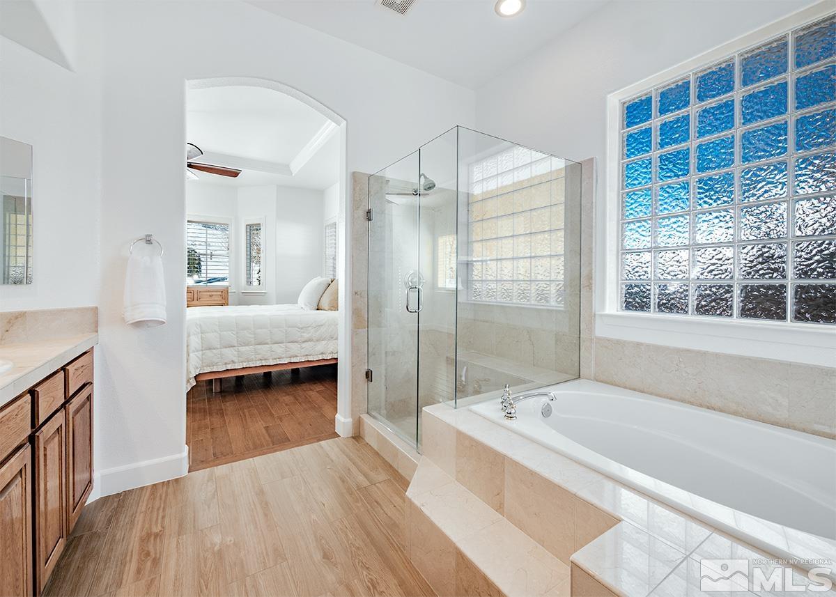 621 Rabbit Ridge Court Reno, NV 89511 - Photo 14 of 26 a view of a bathroom with tub and shower