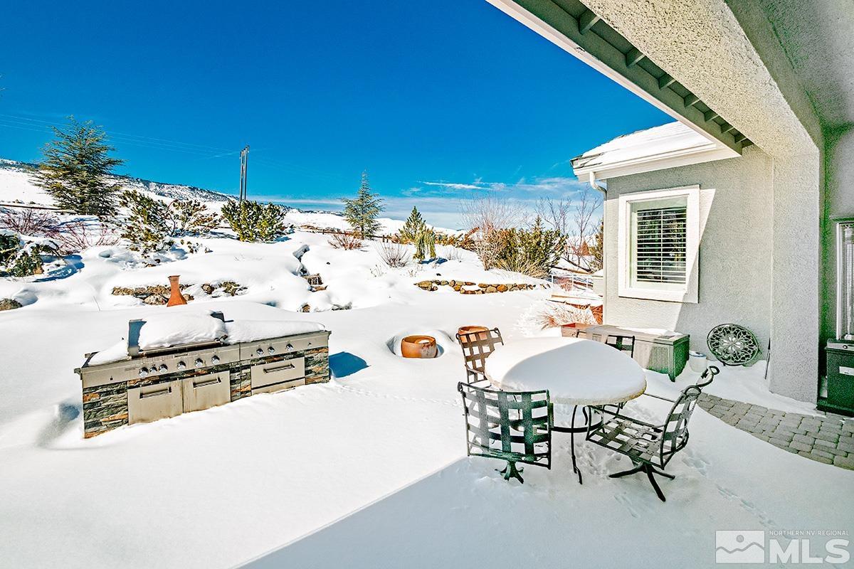 621 Rabbit Ridge Court Reno, NV 89511 - Photo 25 of 26 a view of a chairs and table in the patio