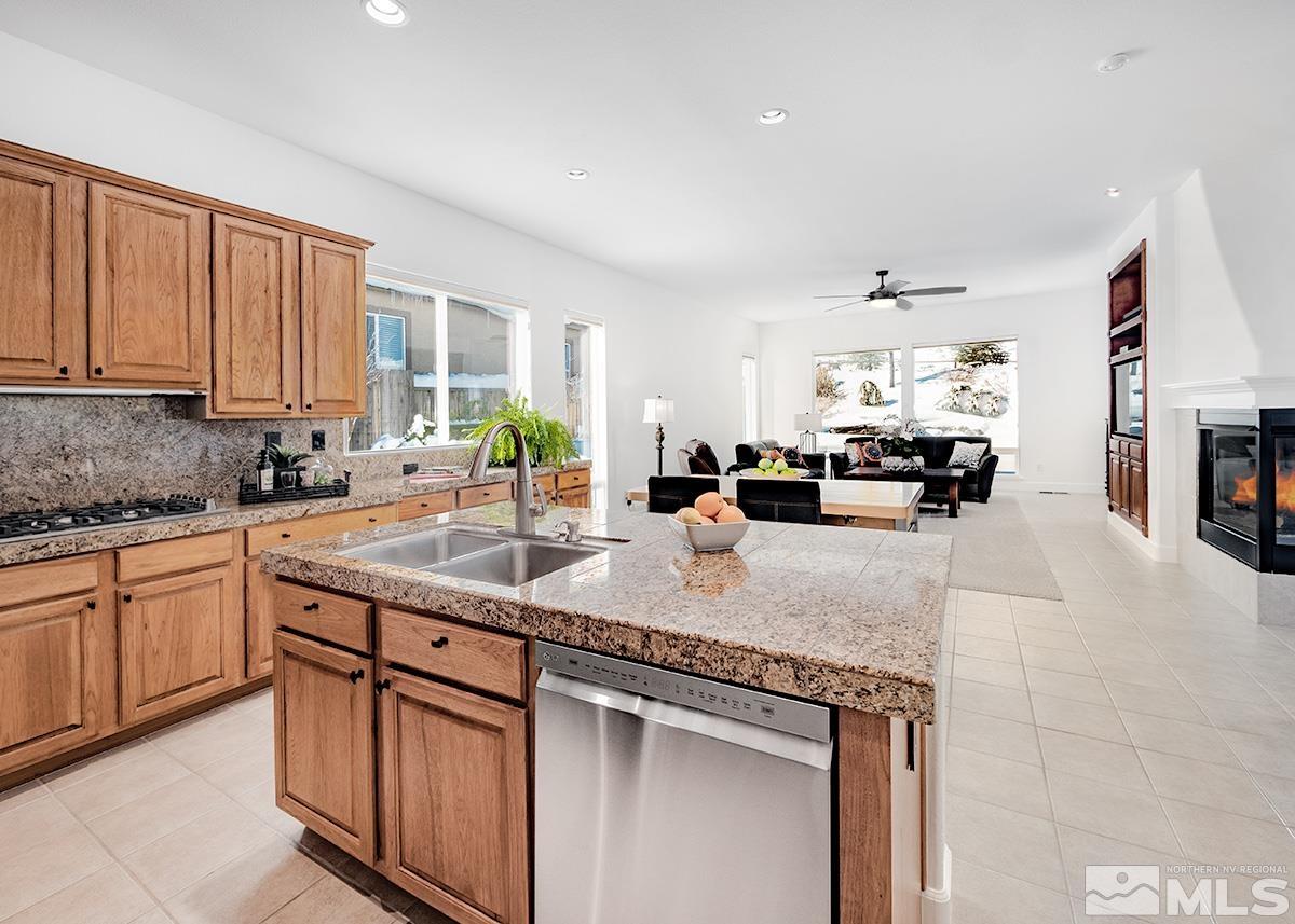 621 Rabbit Ridge Court Reno, NV 89511 - Photo 5 of 26 a kitchen with sink cabinets and window
